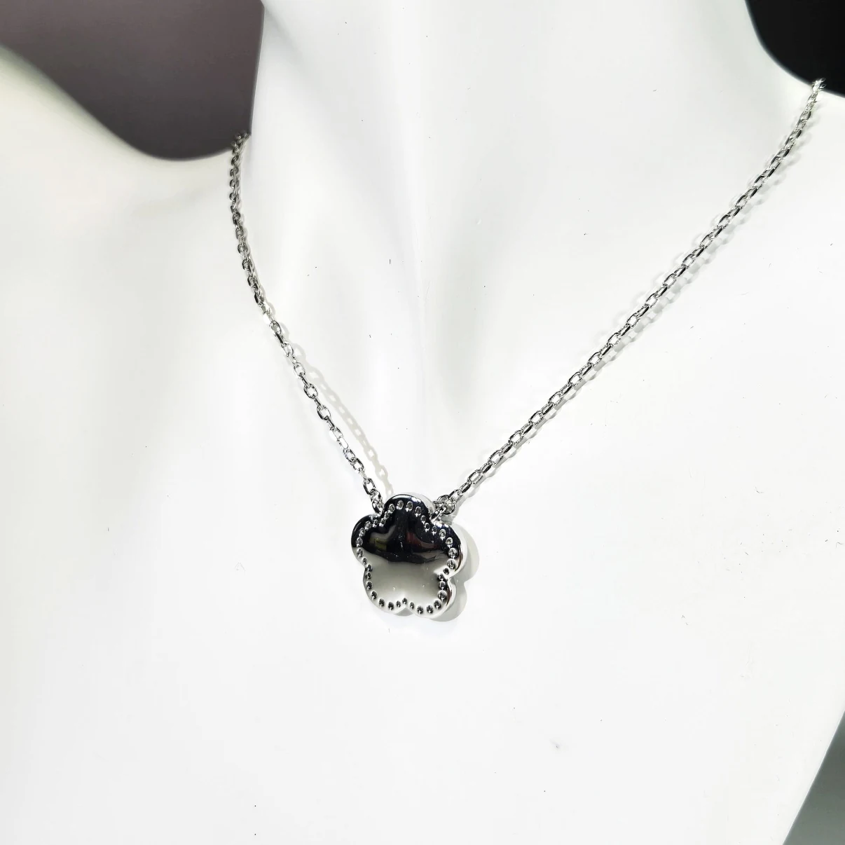 Black clover necklace styled on display bust